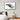 Framed black and white elephant print in modern bedroom, showcasing African wildlife art.
