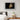 Framed print of a majestic lion artwork in a modern bedroom setting, adding cultural sophistication to the decor.