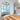 Arch Mirror - Large featuring a wood-styled resin frame and elegant arched design in a modern dining room.