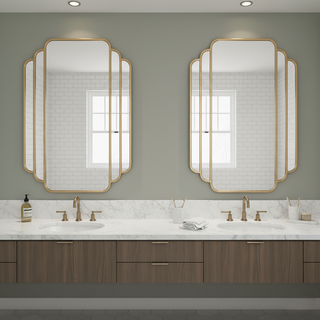 Elegant bathroom featuring a round gold-framed mirror, wall tiles, and a stylish sink arrangement in a small space.