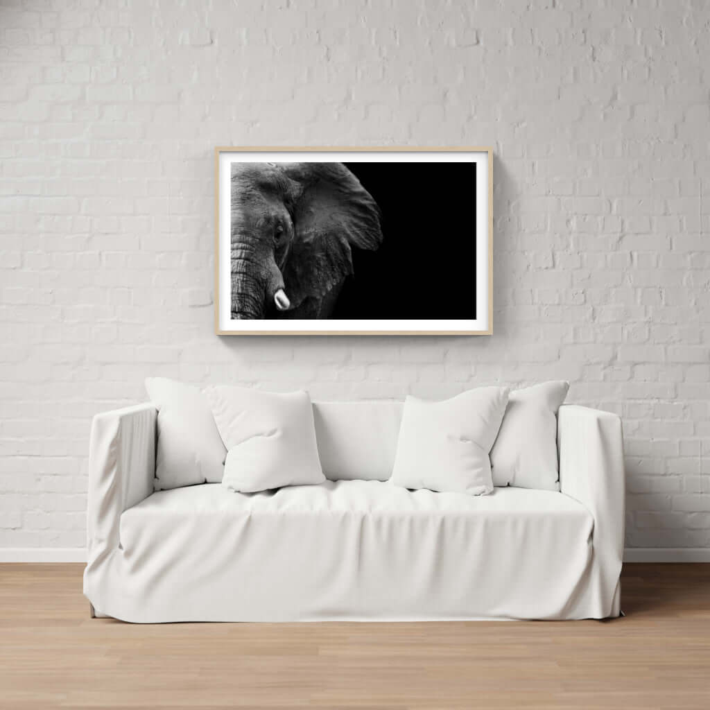 Framed elephant face print in a modern living room, adding sophistication to the decor.