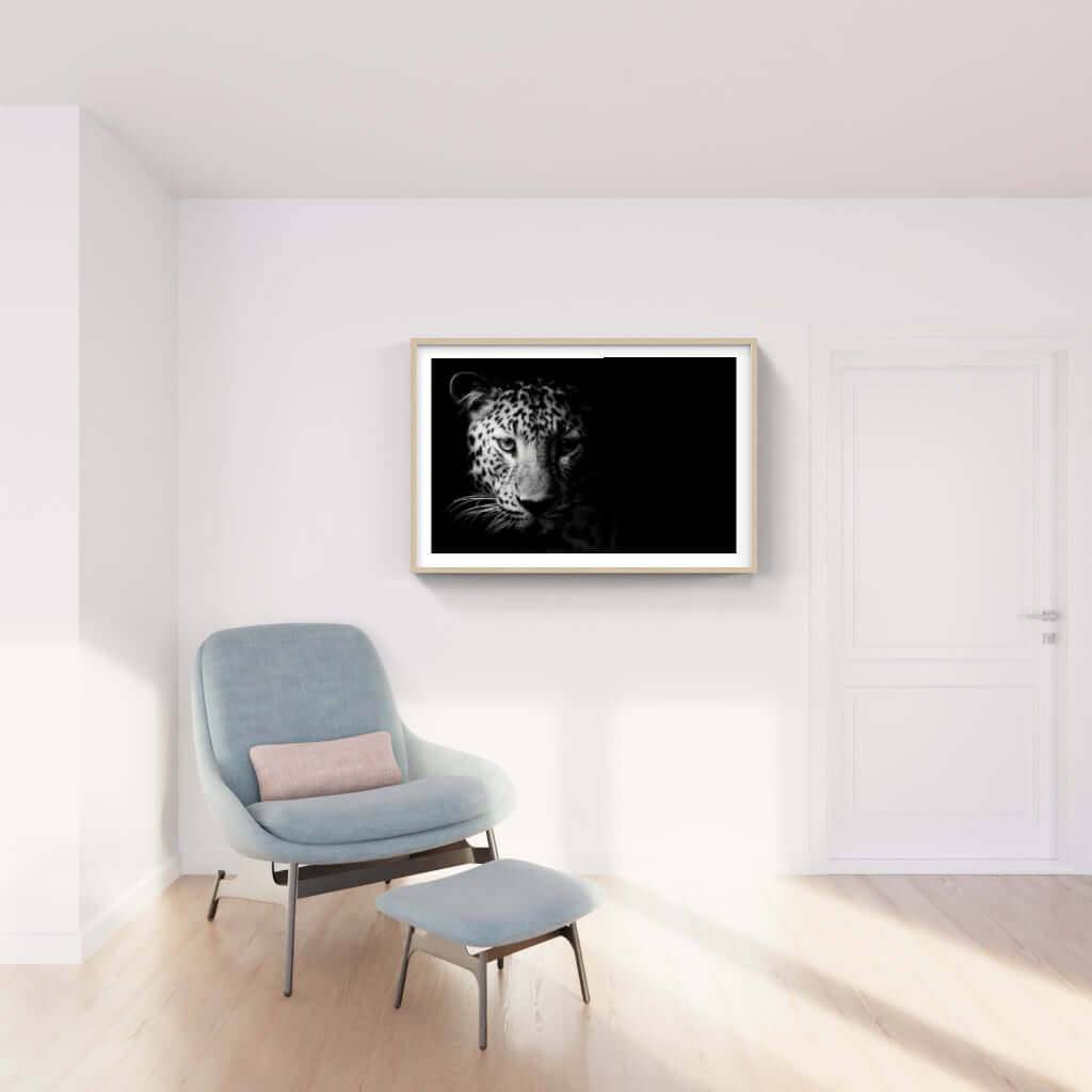 Framed leopard artwork in a modern living room, showcasing African wildlife photography for sophisticated interiors.