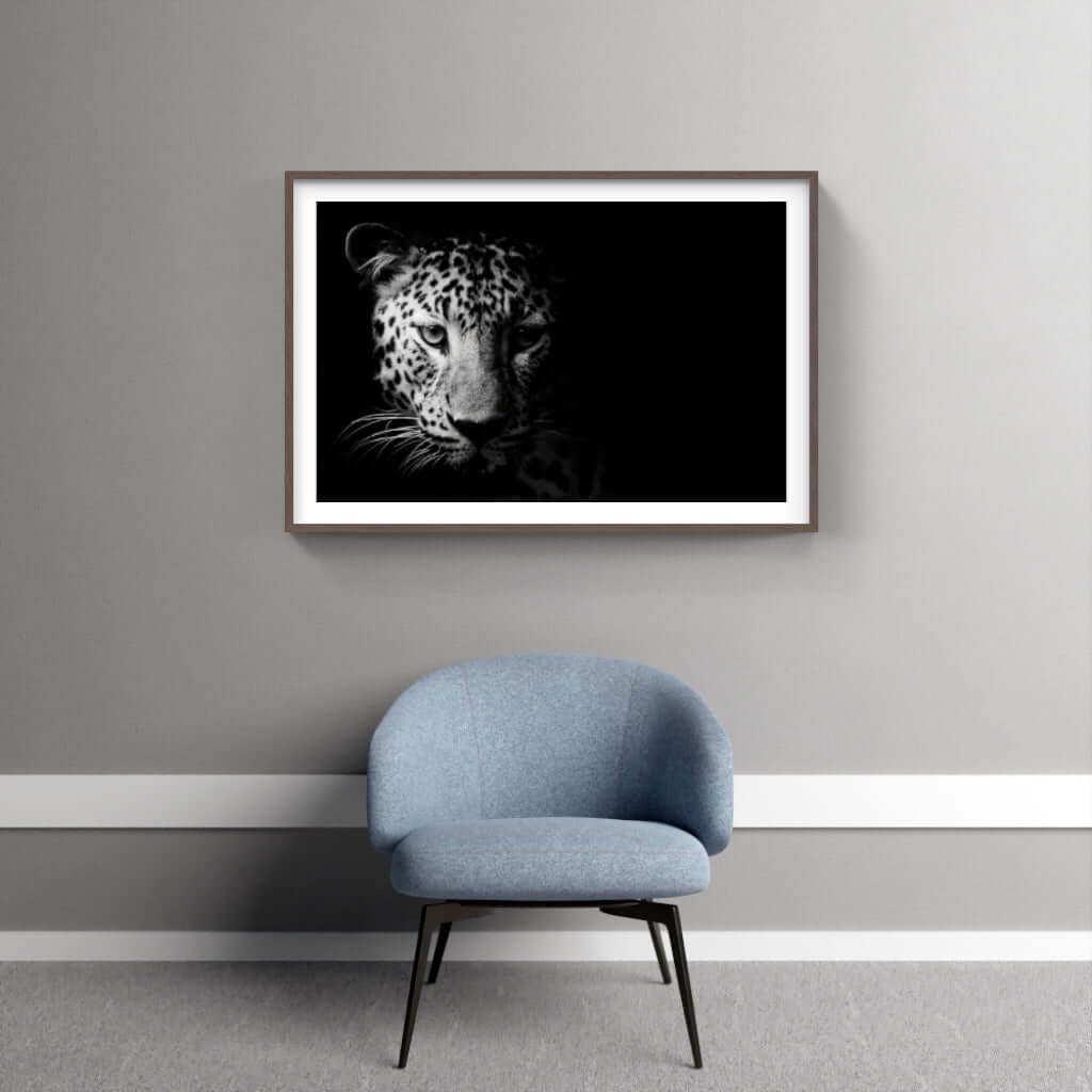 Framed leopard artwork in a modern interior, showcasing African wildlife photography with a sophisticated black and white theme.