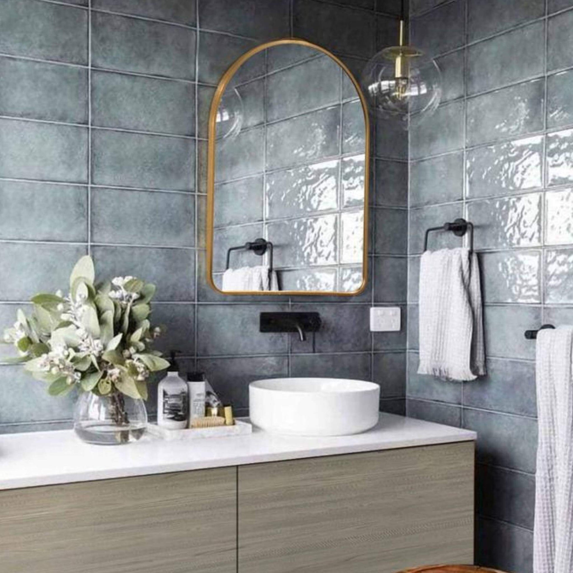 Stylish bathroom showcasing the Rounded Crescent Mirror Small with a sleek aluminium frame above a modern sink.
