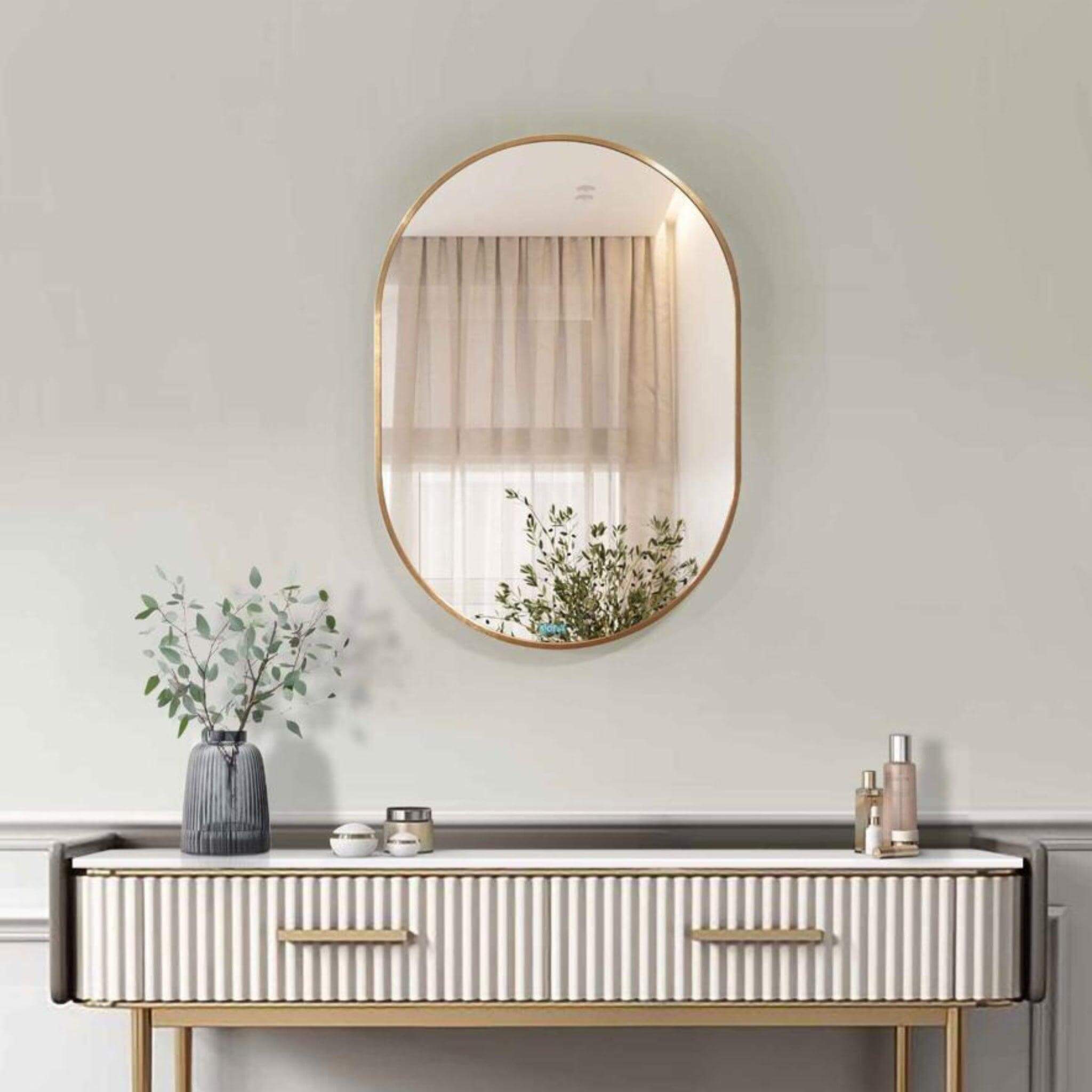 Aura Mirror - Small with sleek round frame above a stylish console table, enhancing modern home decor.