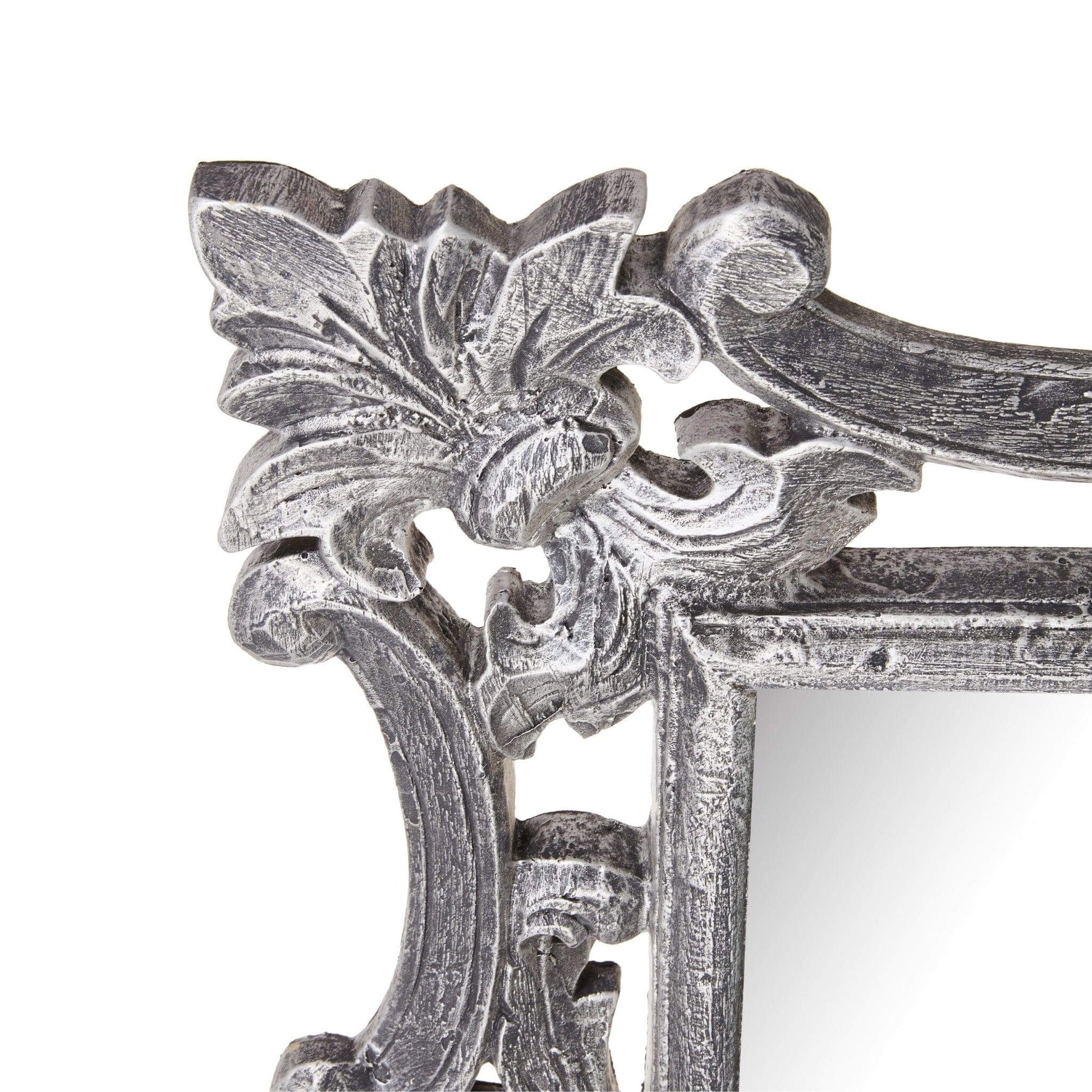 Close-up of Cove Mirror's detailed metal-styled resin frame showcasing timeless elegance and classical design.