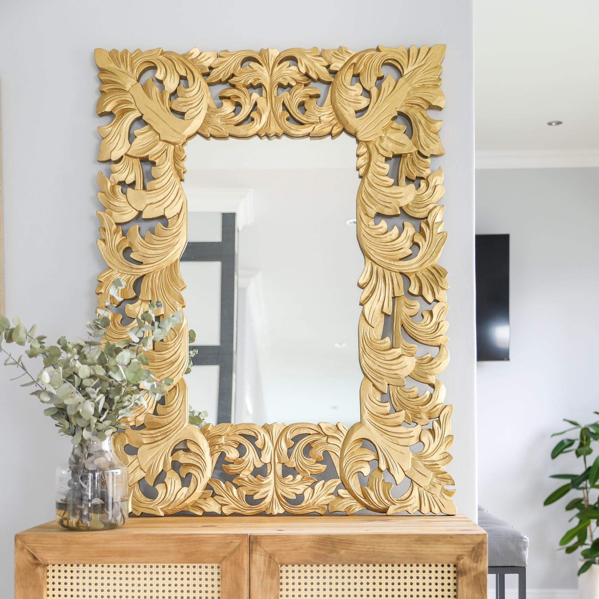 Ornate gold Envy Mirror with a detailed frame, enhancing classic home decor and elegance.
