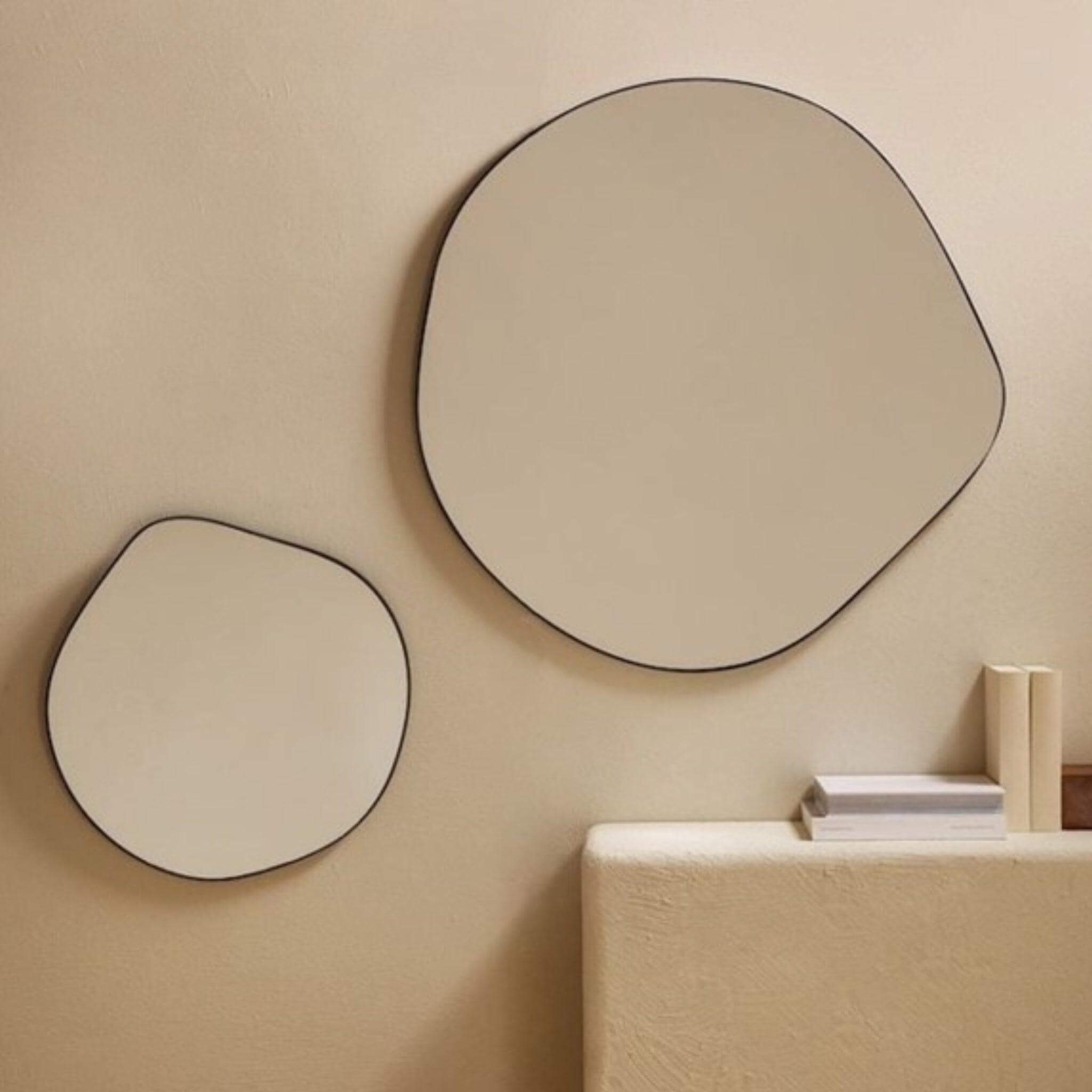 Ira Irregular Mirror - Large and small mirrors with sleek black edges, adding modern elegance to home decor.