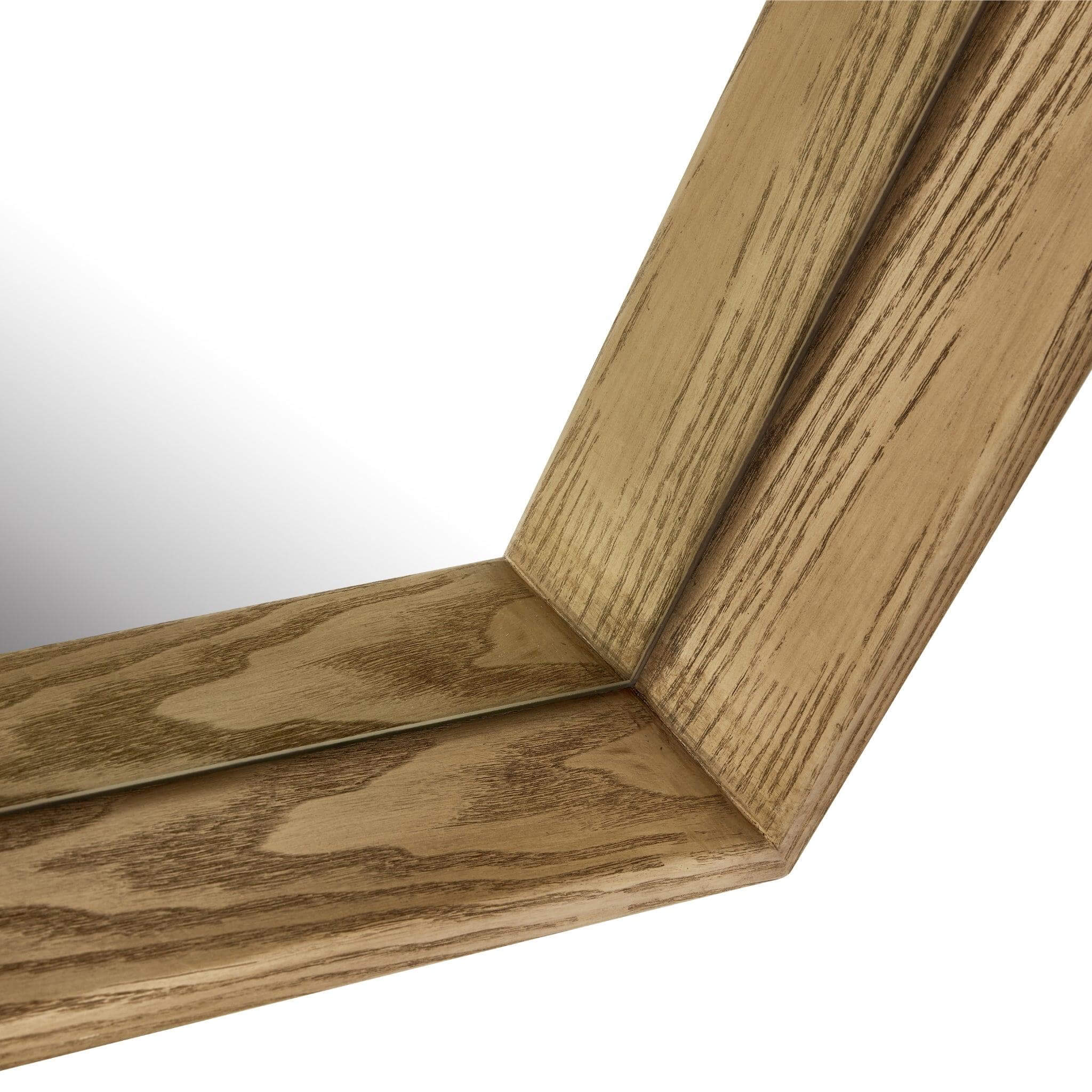 Close-up of Jupiter Mirror's sunken wood-styled resin frame in light finish, showcasing modern elegance.