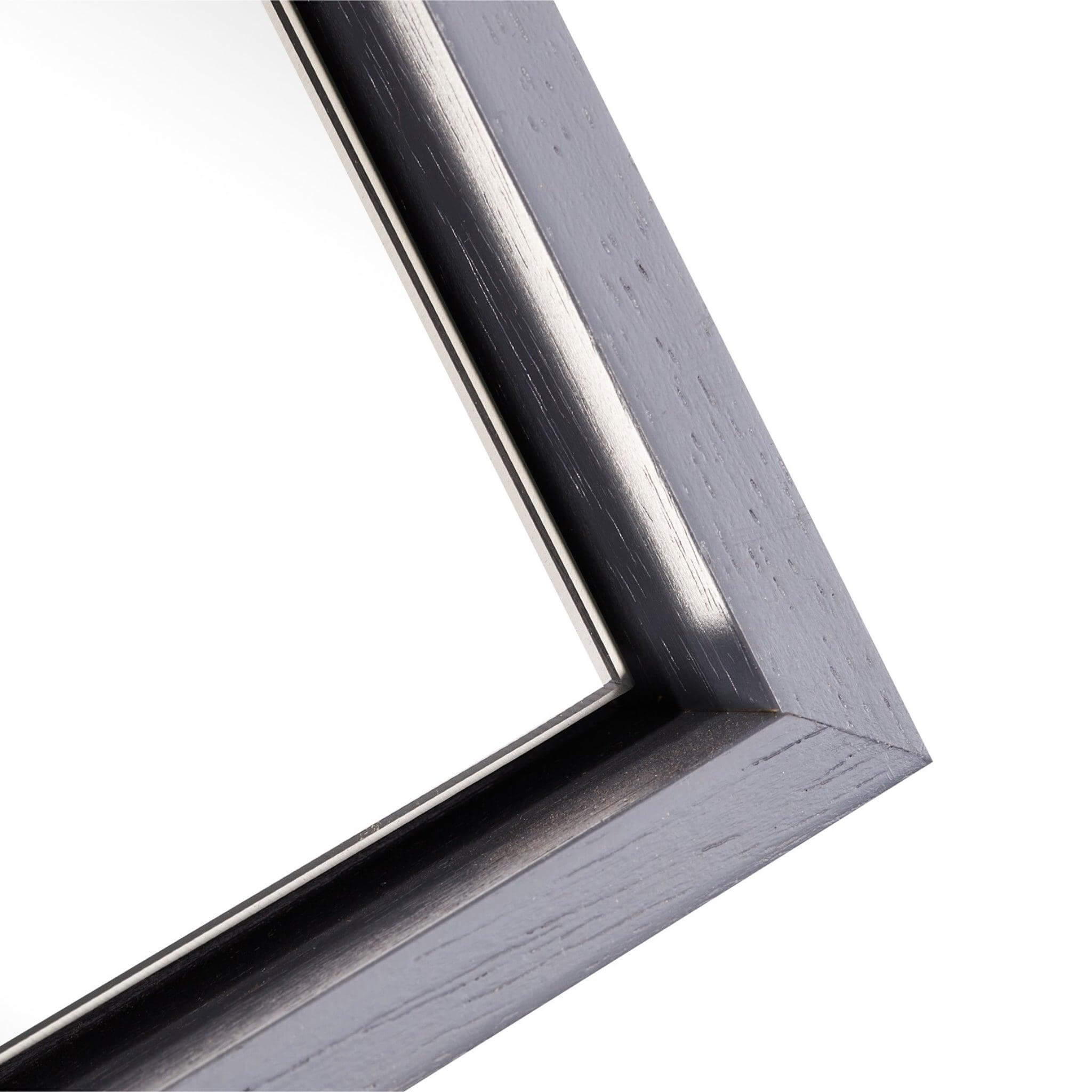 Close-up of the sleek floating wooden frame of the Lily Mirror - Large, showcasing its modern design.