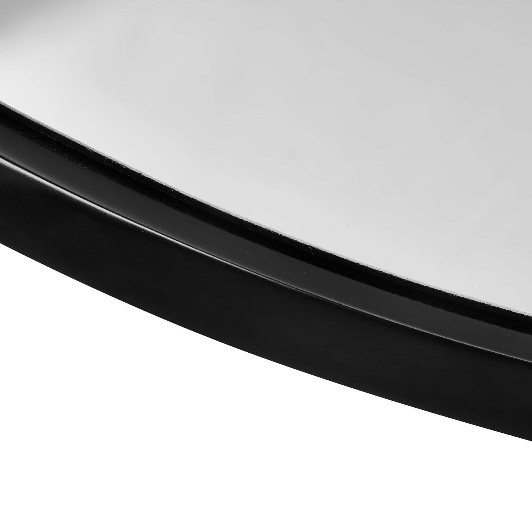 Close-up of the sleek resin frame of the Lily Round Mirror with modern black finish.