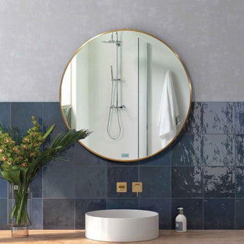 Maan Mirror - Gold frame, 1200mm diameter, displayed above a bathroom basin