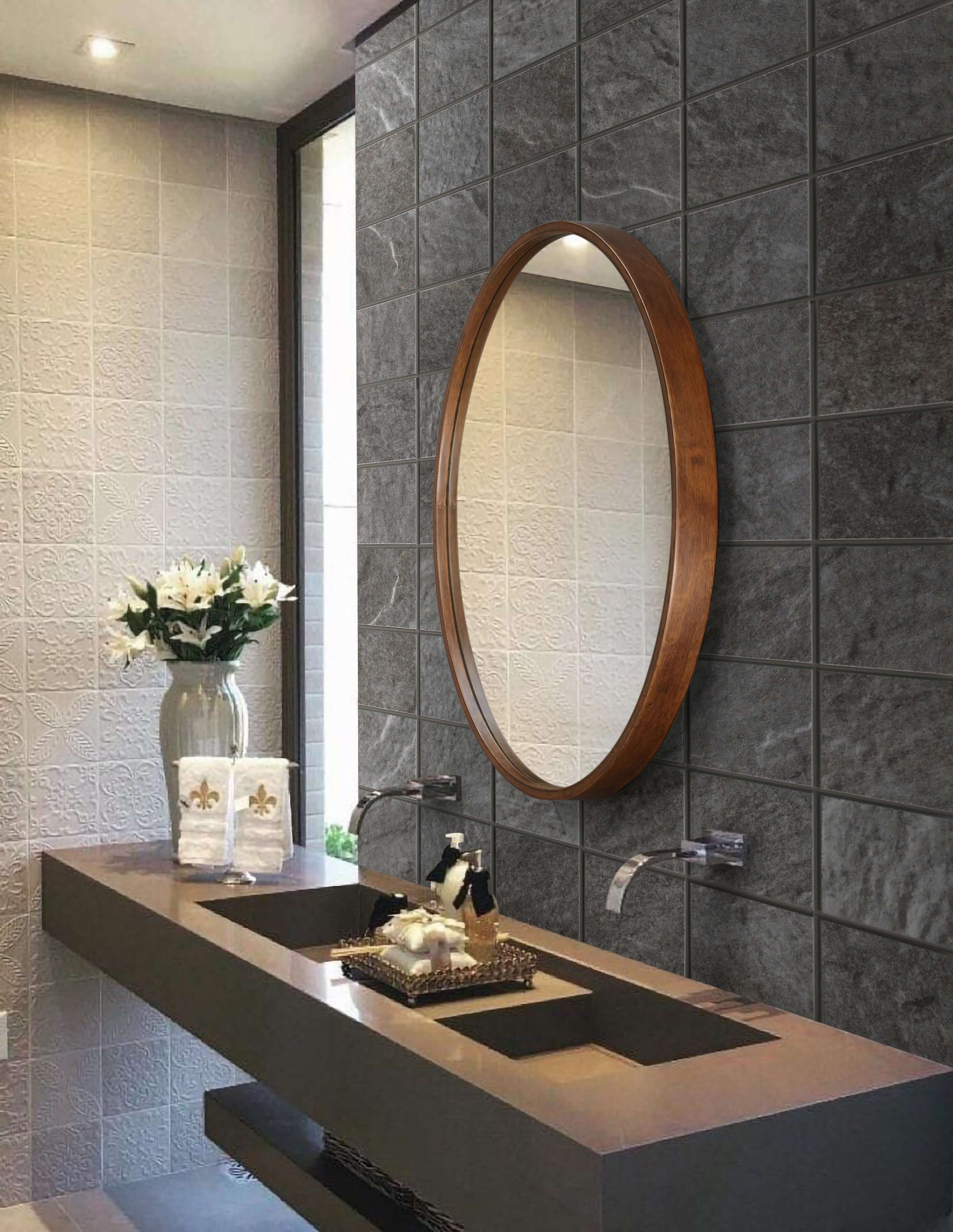 Round 685 Mirror above modern vanity in stylish bathroom with natural wood frame and recessed glass design.