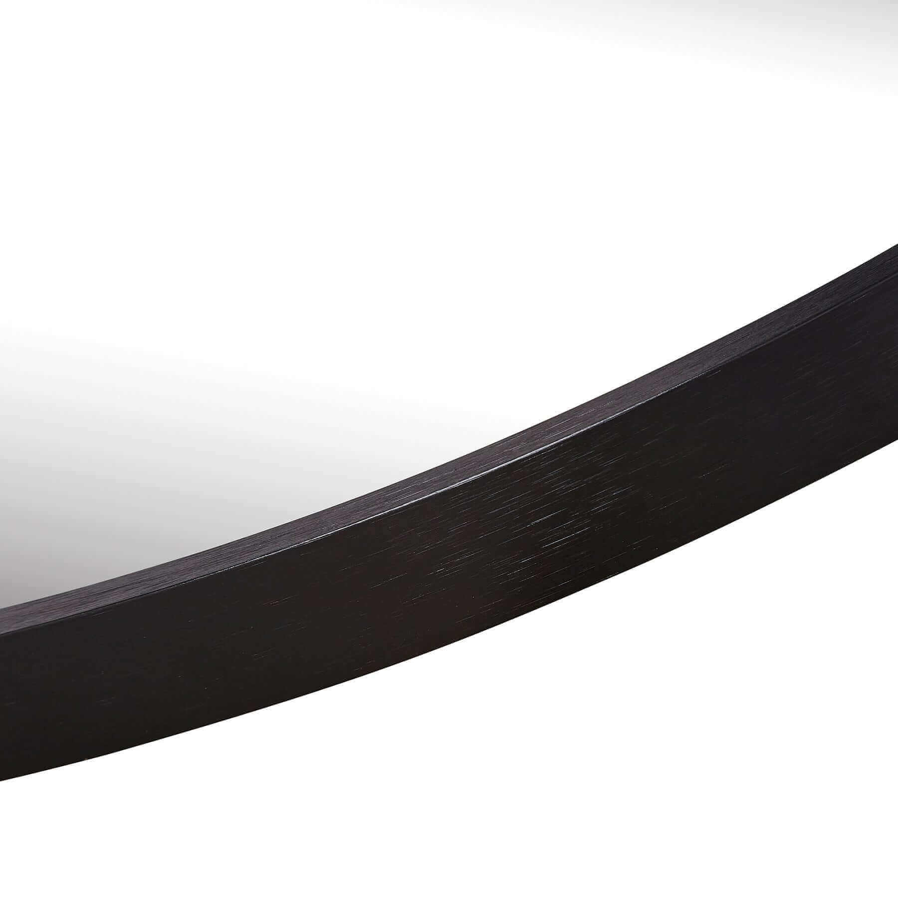 Close-up of the sleek aluminium frame of a round small mirror showcasing elegant design and lightweight features.