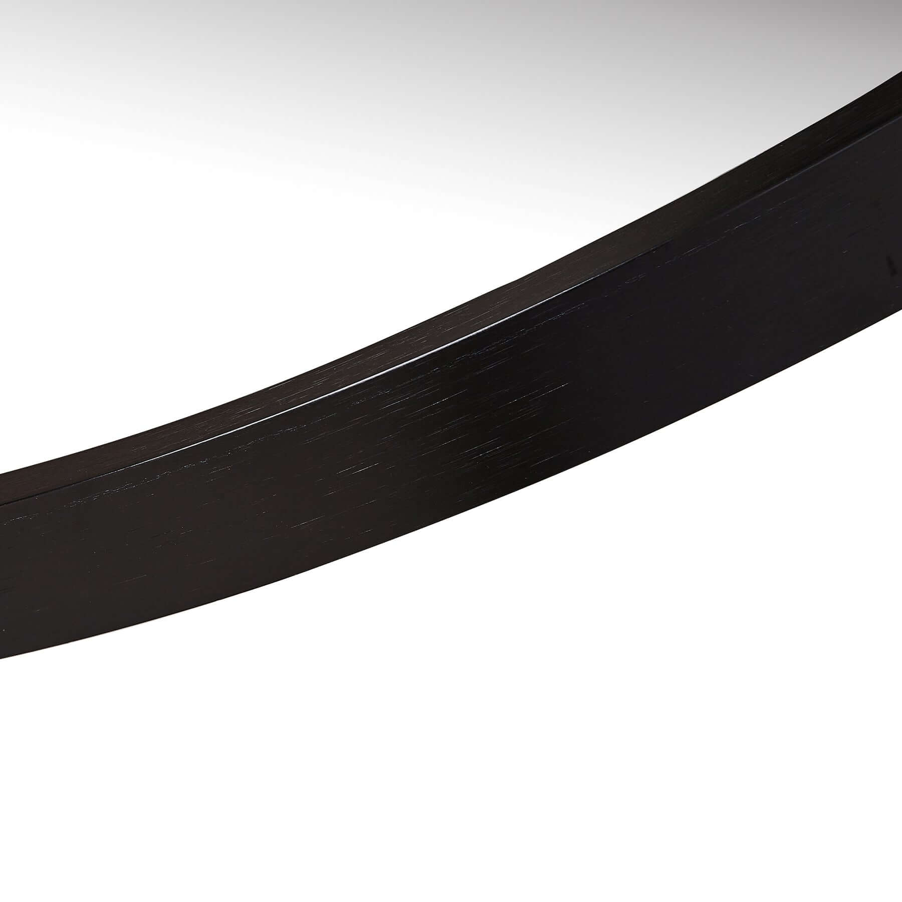 Close-up of the sleek black frame of the Bravo Mirror Range, showcasing its modern design and polished finish.