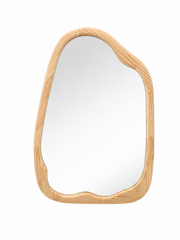 Irregular wall mirror with a natural wood frame.