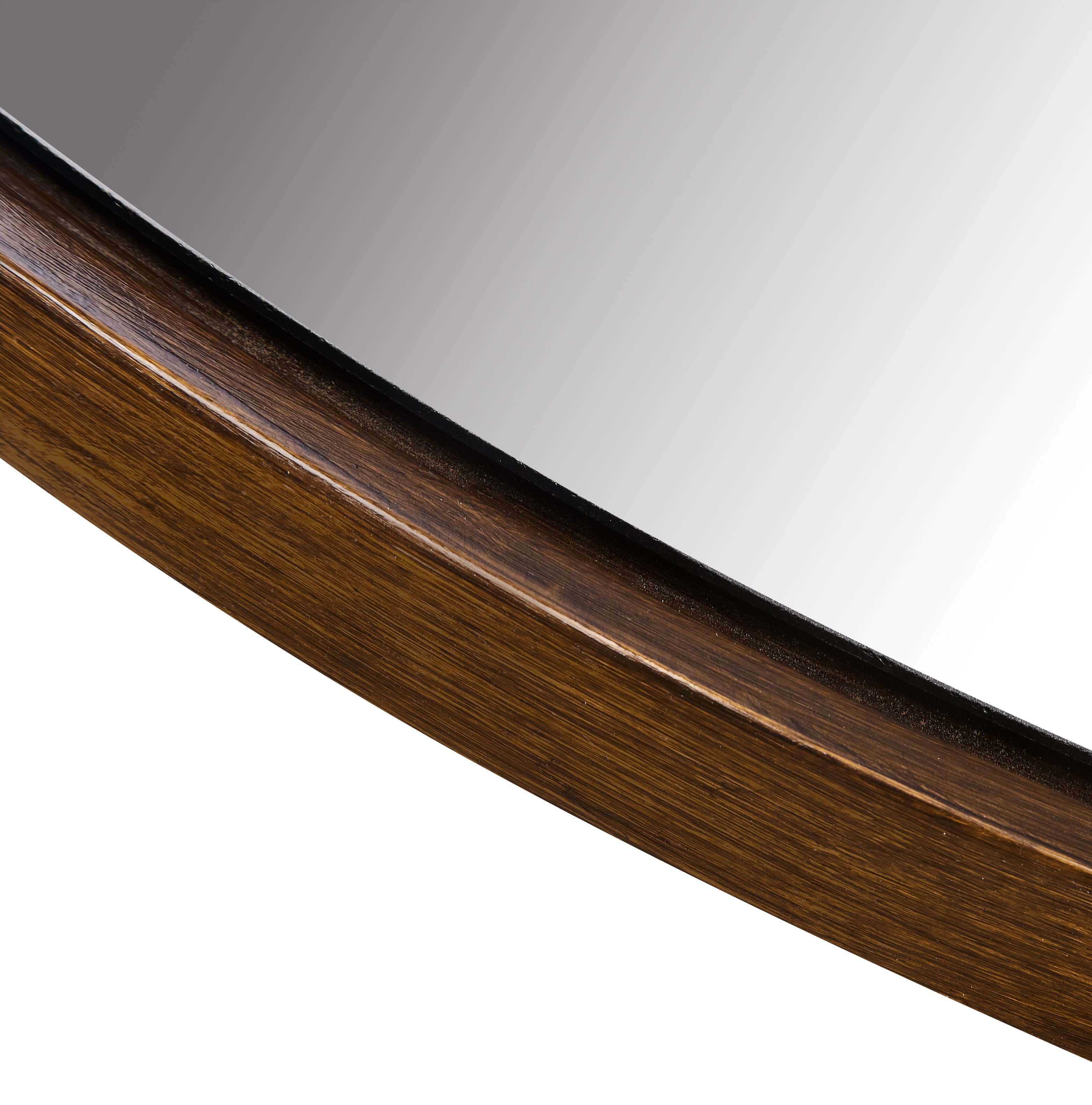 Lily Round Mirror close-up of sleek resin frame with modern design and a polished surface.