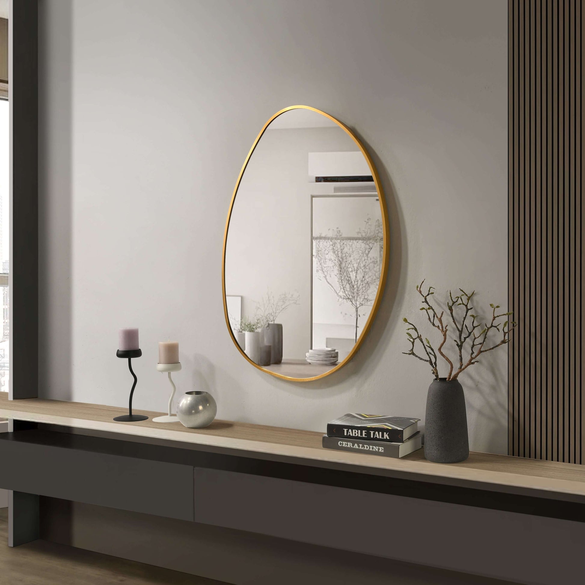 Aluminium frame mirror 600x800mm with a chic gold finish in a modern living room setting.