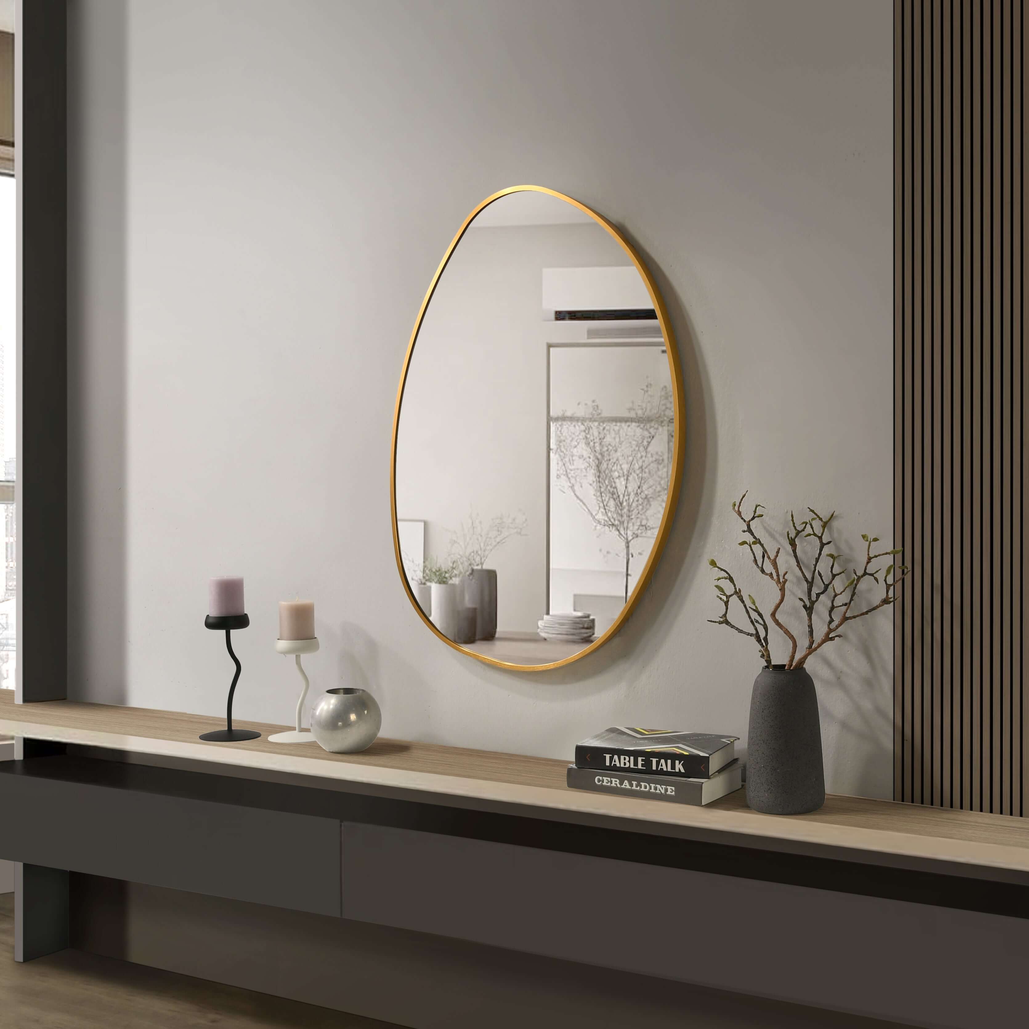 Aluminium frame mirror 600x800mm with a chic gold finish in a modern living room setting.