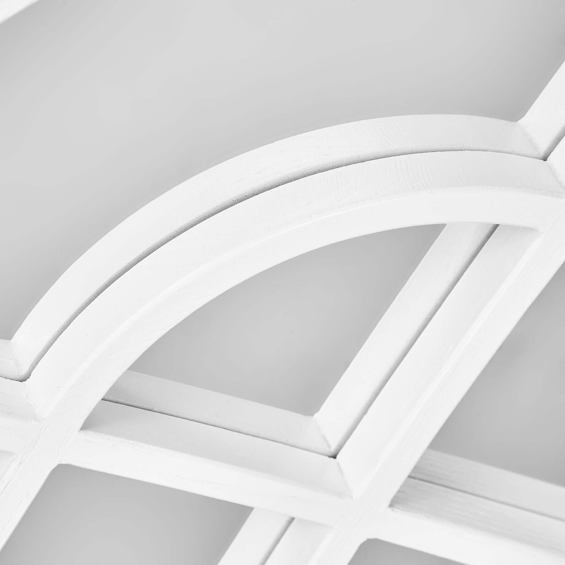 Close-up of the arch design on the wood-styled resin frame of the Arch Mirror.