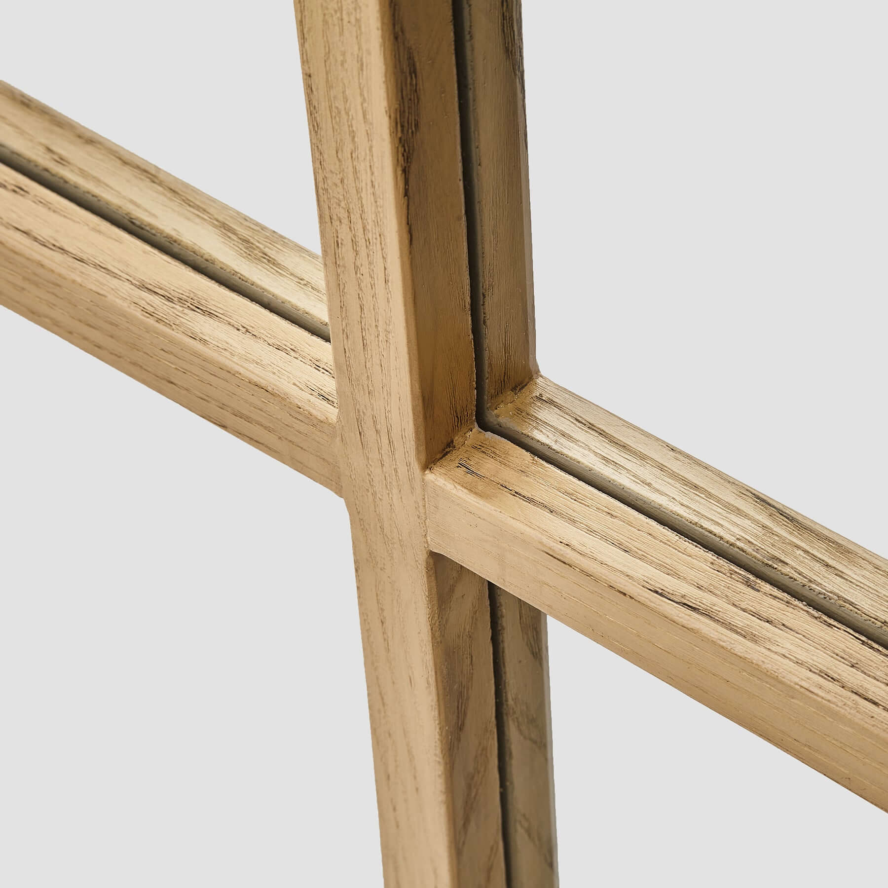 Close-up of the wood-styled resin frame of the Dutch Mirror, showcasing its modern window panel design.