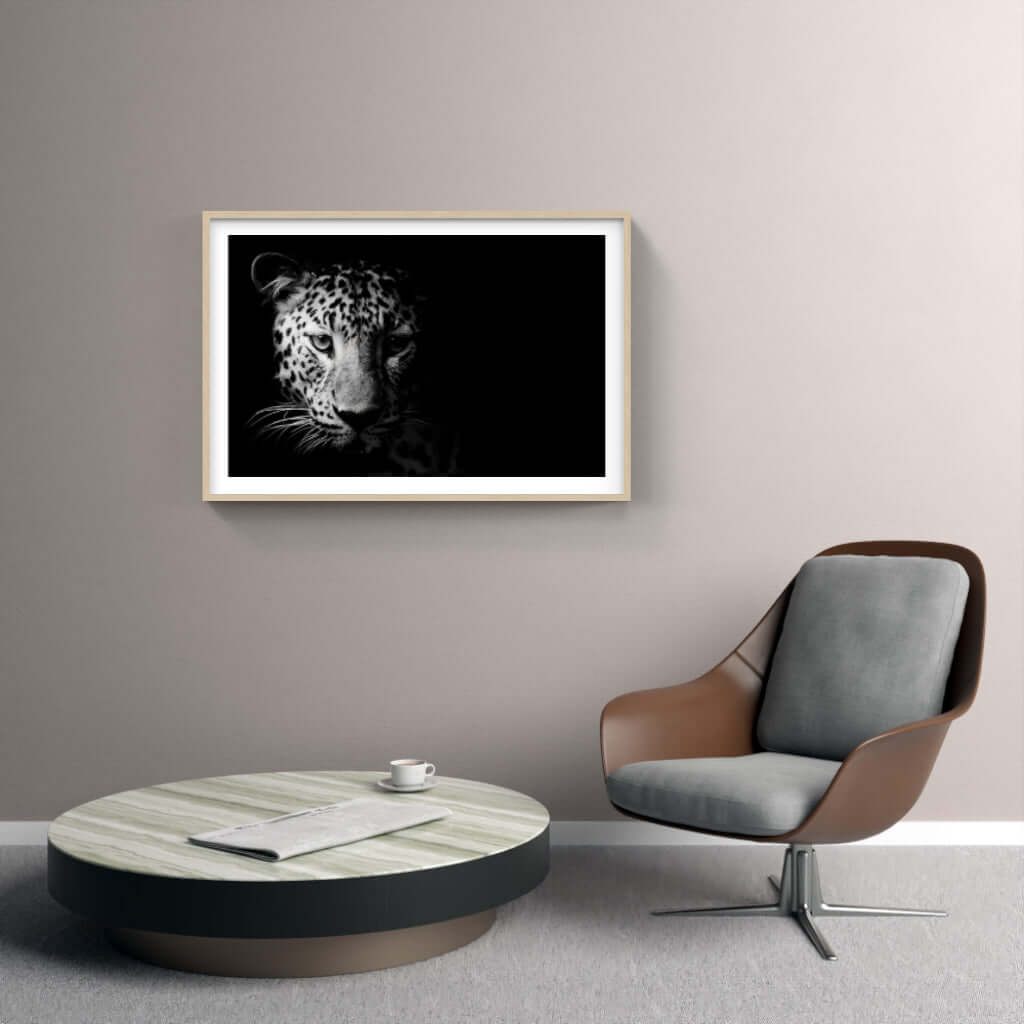Framed African print of a leopard's face, enhancing modern interior decor with wildlife artistry.