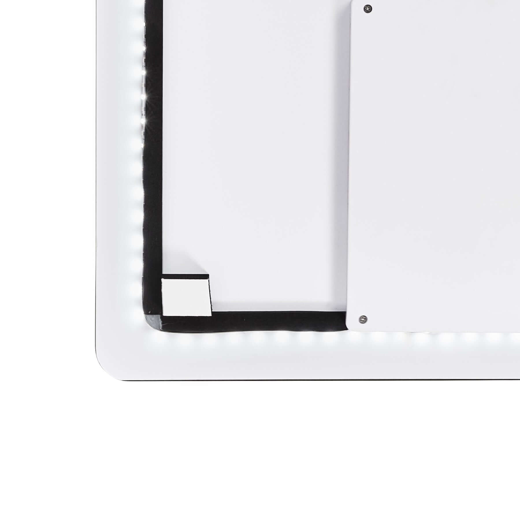 Close-up of the Crescent Frameless LED Mirror's sleek, illuminated edge and modern design.