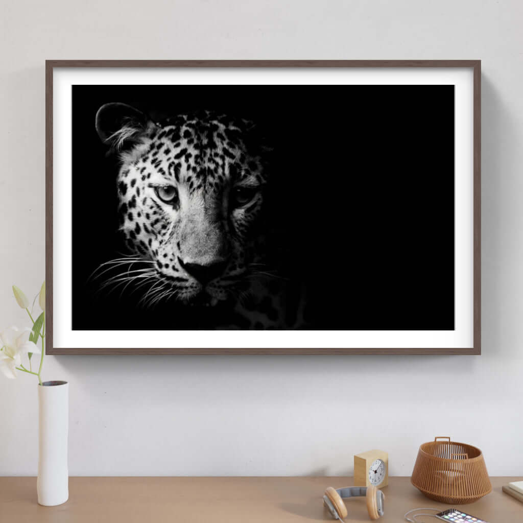 Framed African print of a leopard's face, showcasing wildlife elegance for modern decor.
