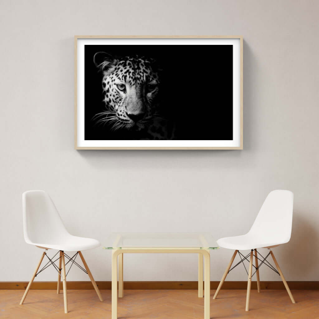 Framed leopard artwork on a wall, showcasing high-resolution wildlife photography for stylish interiors.