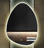 Organic frameless LED mirror with a soft backlit glow.